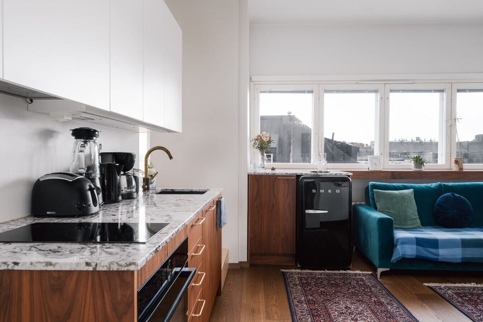Apartment kitchen is modern and well equipped