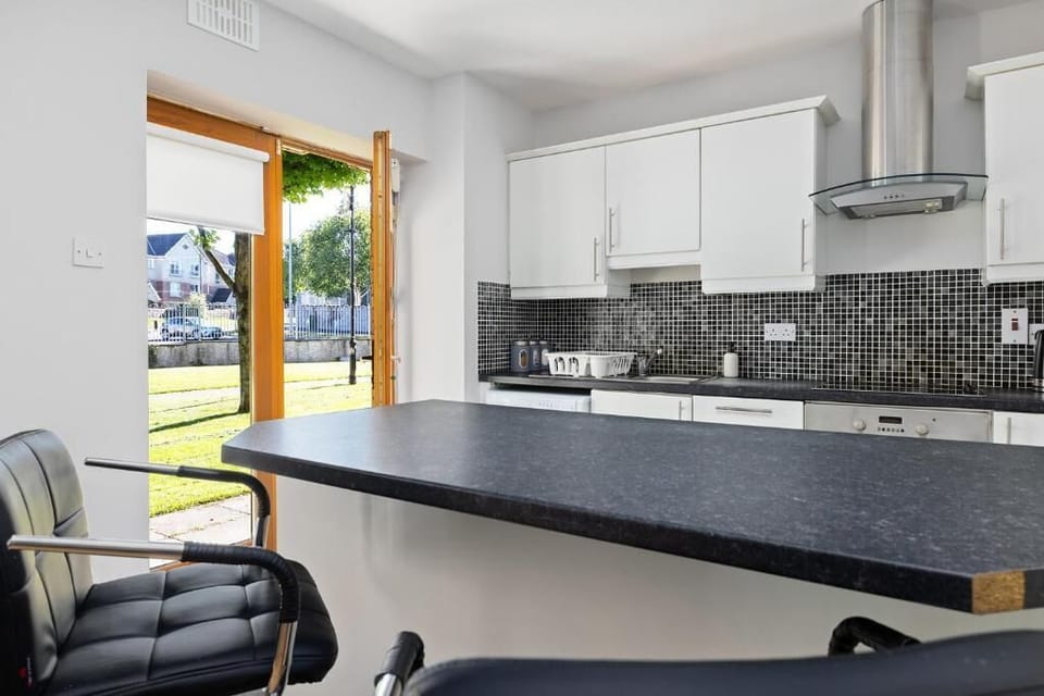 Sunlit kitchen with easy outdoor access.