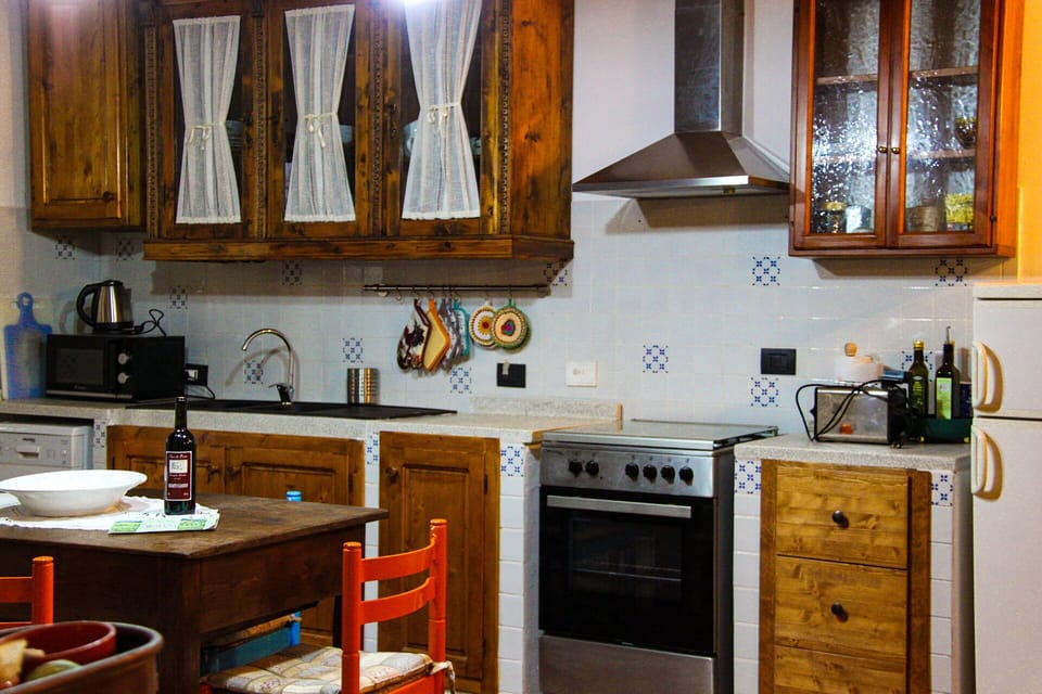 Kitchen, Major Appliance, Kitchen Appliance, Furniture, Countertop, Cabinetry, Wood, Flooring, Interior Design, Kitchen Stove
