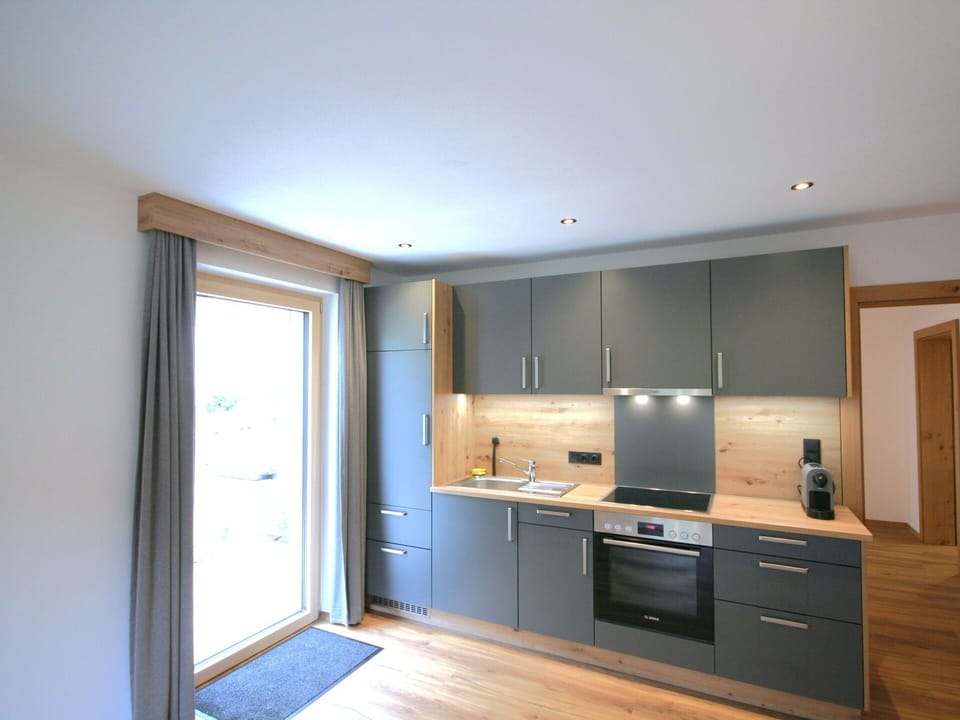 Furniture, Kitchen, Flooring, Interior Design, Countertop, Wood, Cabinetry, Kitchen Appliance, Floor, Ceiling