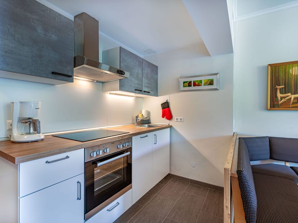 Interior Design, Kitchen, Countertop, Flooring, Major Appliance, Wood, Ceiling, Cabinetry, Floor, Room