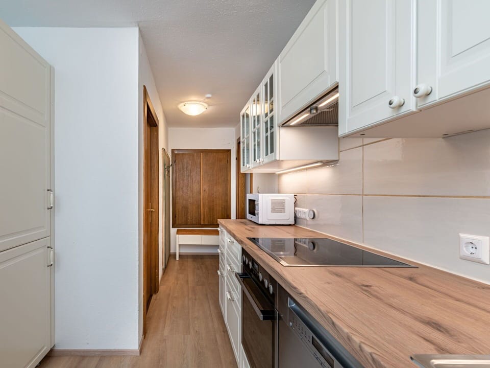 Countertop, Kitchen, Cabinetry, Kitchen Appliance, Flooring, Major Appliance, Interior Design, Wood, Furniture, Floor