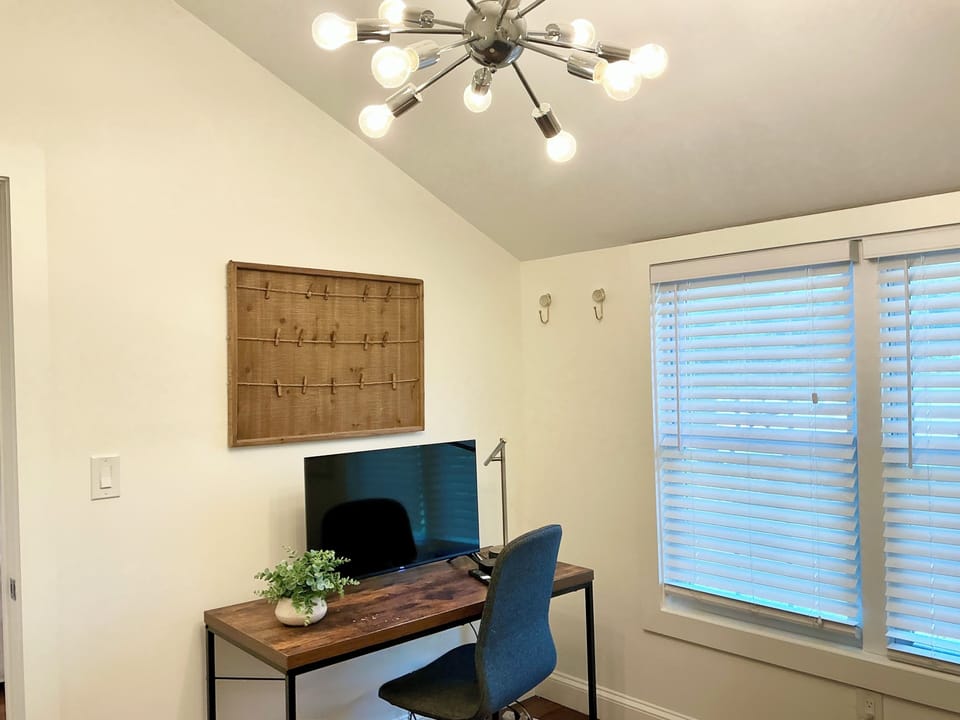 Den can also be used as an office- TV on table