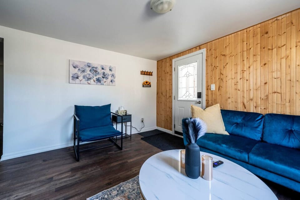 Step into comfort and style. Relax on the plush velvet sofa or unwind in the chic accent chair in this inviting living area. It`s the perfect spot to kick back after exploring, offering a warm welcome.