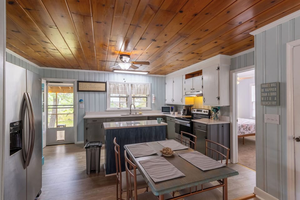 Dining Area - The natural light, open kitchen and wood ceilings in the dining area are made for great conversations.