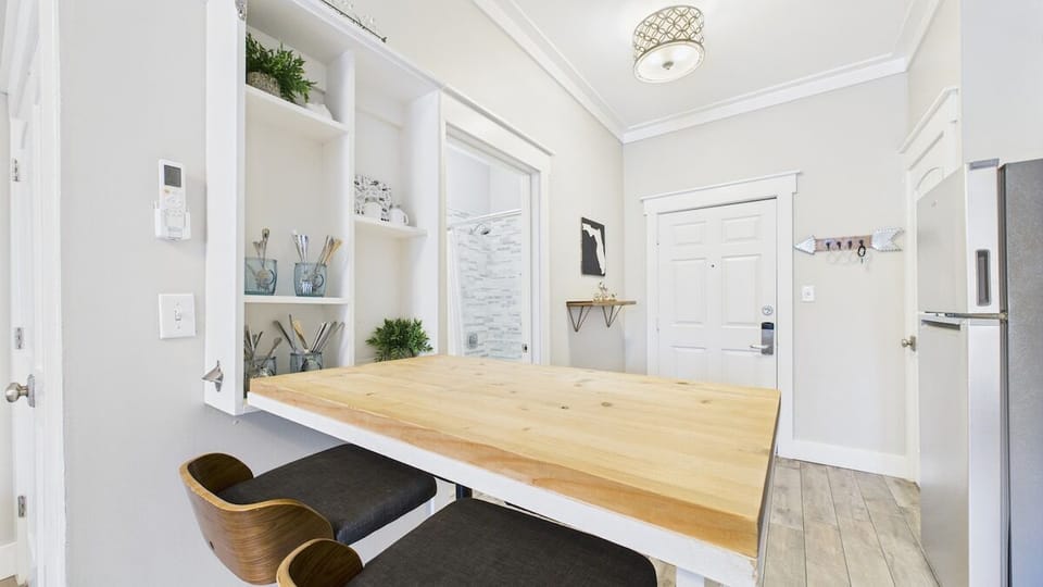 Silverware in cabinet behind table