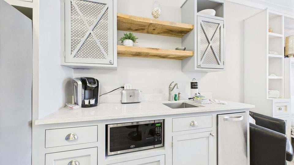 Coffee maker and toaster in kitchenette