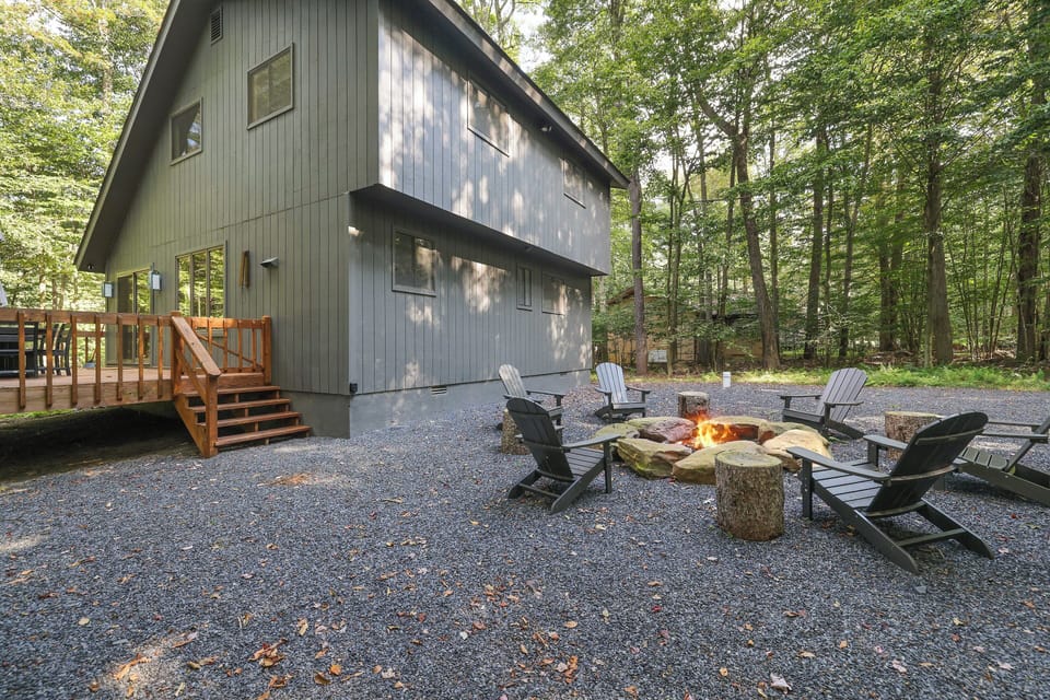 Embrace cozy evenings by the fire pit in the serene backyard
