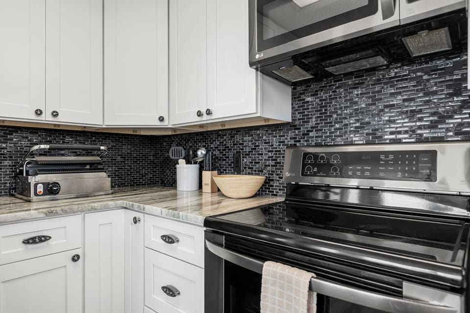 Cook up a storm with modern appliances and stylish black accents!