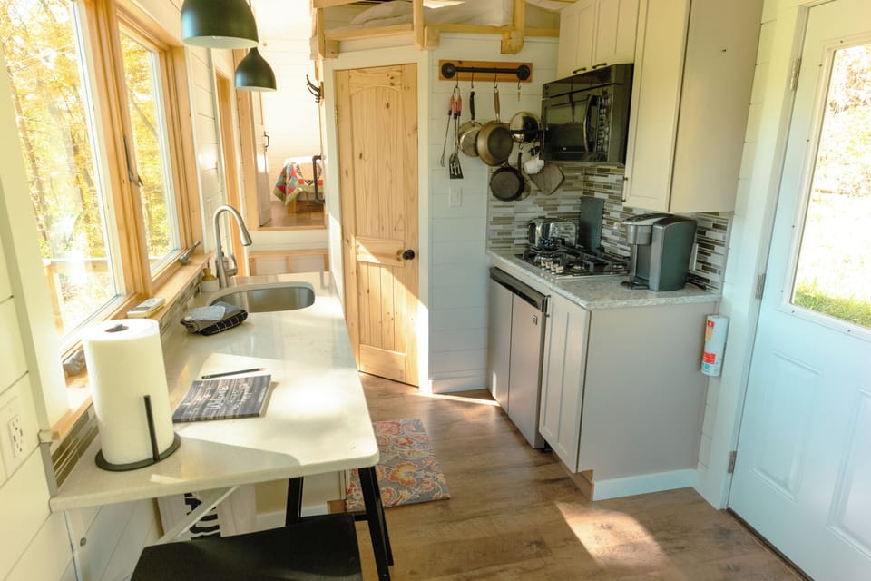 Kitchen Area with View of Bathroom Door on Towards the Bedroom