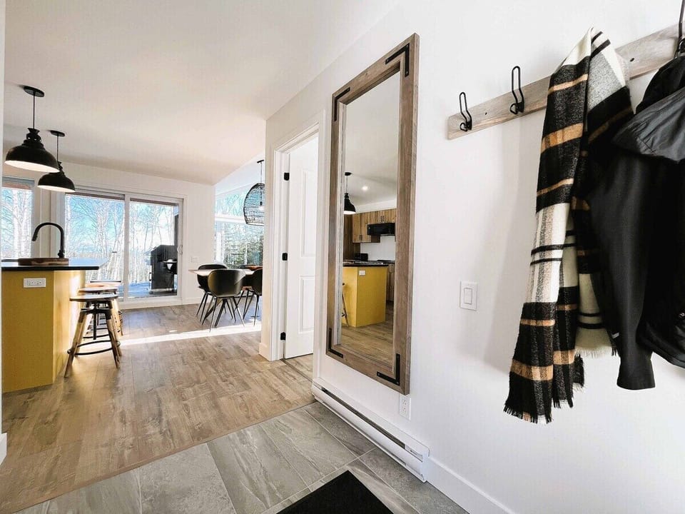 Modern entryway leading to the kitchen dining area.