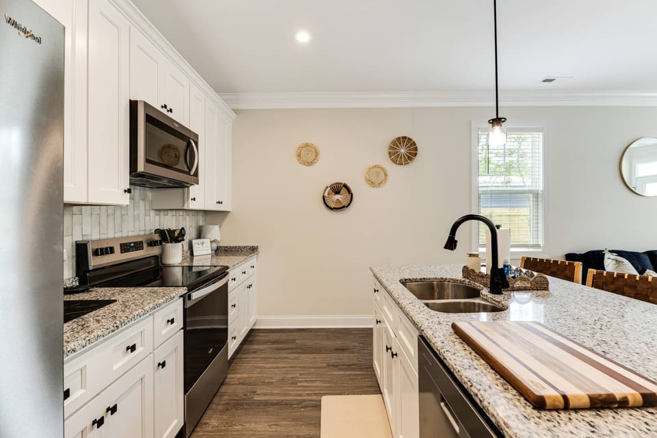 Modern kitchen has all of the appliances needed to make your favorite meals and plenty of counter space for prep work