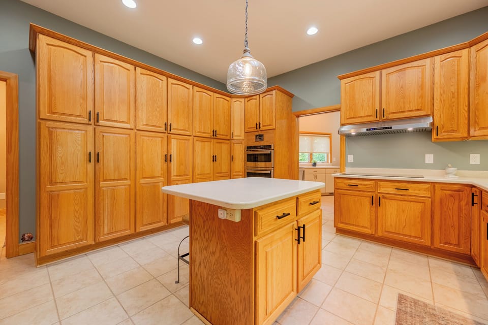 Freshly updated kitchen with island seating. 