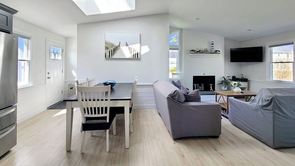 Dining area with back door to outdoor shower access