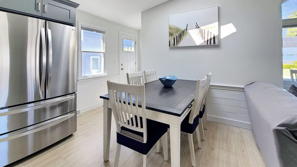 Dining area with back door to access to enclosed outdoor shower