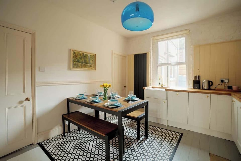 Light filled kitchen and dining. With kettle, toaster, cafetiere, pans, roasting dishes, knives, utensils, cups, glasses, crockery and cutlery. As well as picnic equipment and a flask.
