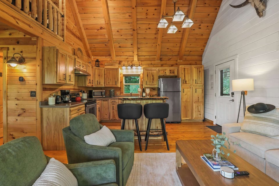 A-frame interior design of the big cabin with open concept living and walkout access to the deck.