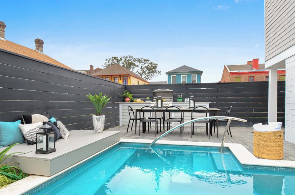 Shared Outdoor Area with Porch | Seasonal Heated Pool | Grill | Outdoor Dining Table | Outdoor Seating Area | Shared with Other Unit in the Building