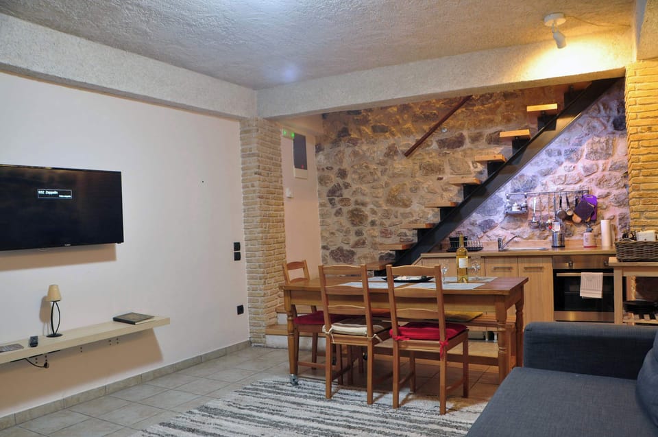 Cozy Stone-Walled Dining Area – Inviting space ideal for shared meals and relaxed moments.