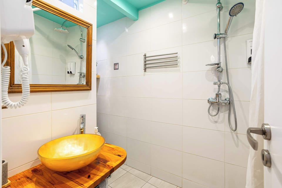 Modern Bathroom with Walk-In Shower and Wooden Vanity