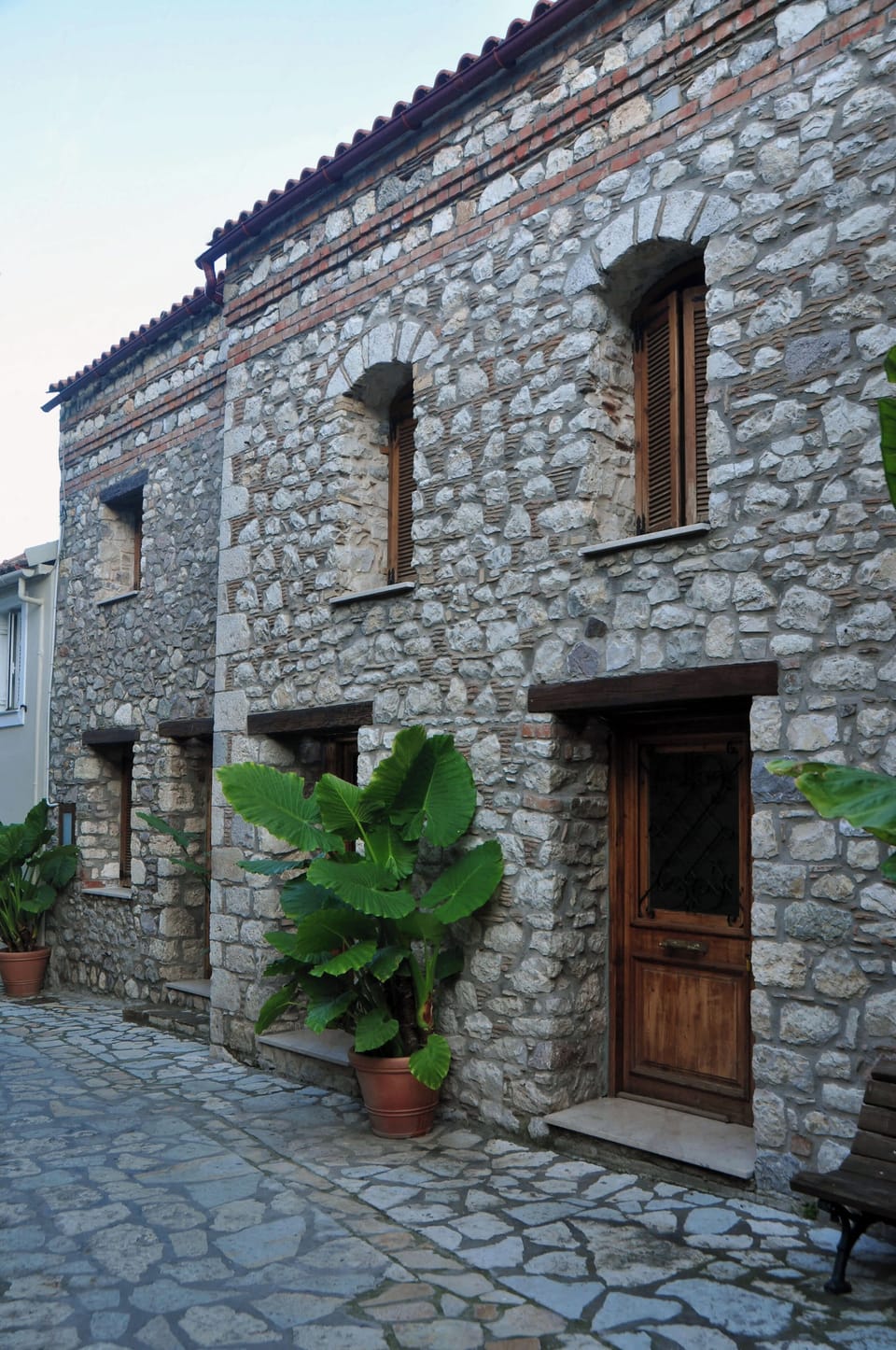 Traditional Stone Apartment Exterior – Classic stone façade with rustic charm and authentic Greek architecture.