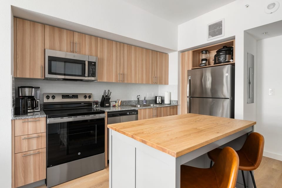 Settle in and relax in this cozy living area, thoughtfully furnished with a dining table and chairs.