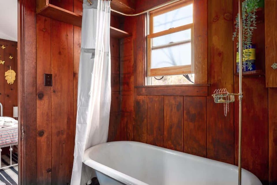 Relax and unwind in the vintage cast iron tub — a great way to end your day.