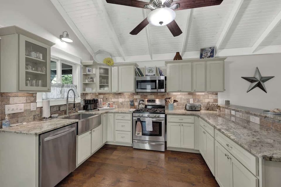 The kitchen offers ample counter space and stainless steel appliances, perfect for preparing anything from full meals to quick snacks.