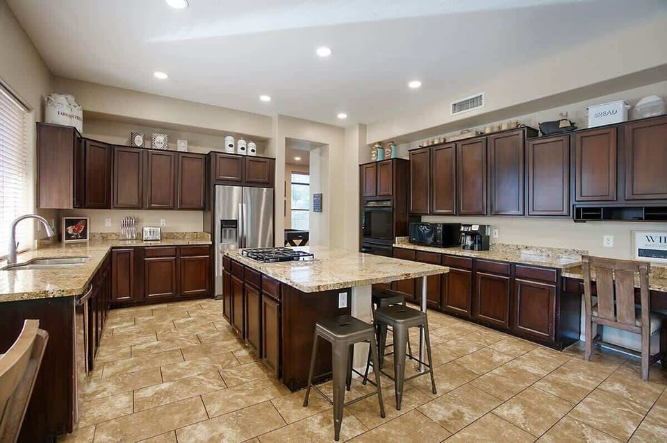 Fully equipped kitchen with granite counters and bar seating for easy meals.