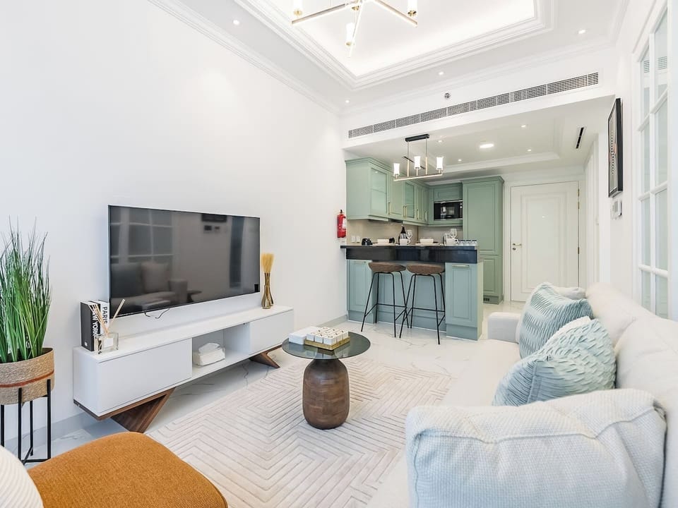 Relax in the cozy living room with a comfy sofa bed and enjoy your favorite shows on the wall-mounted TV. Dine in style at the chic bar-style table for two—perfect for intimate meals or casual snacks.