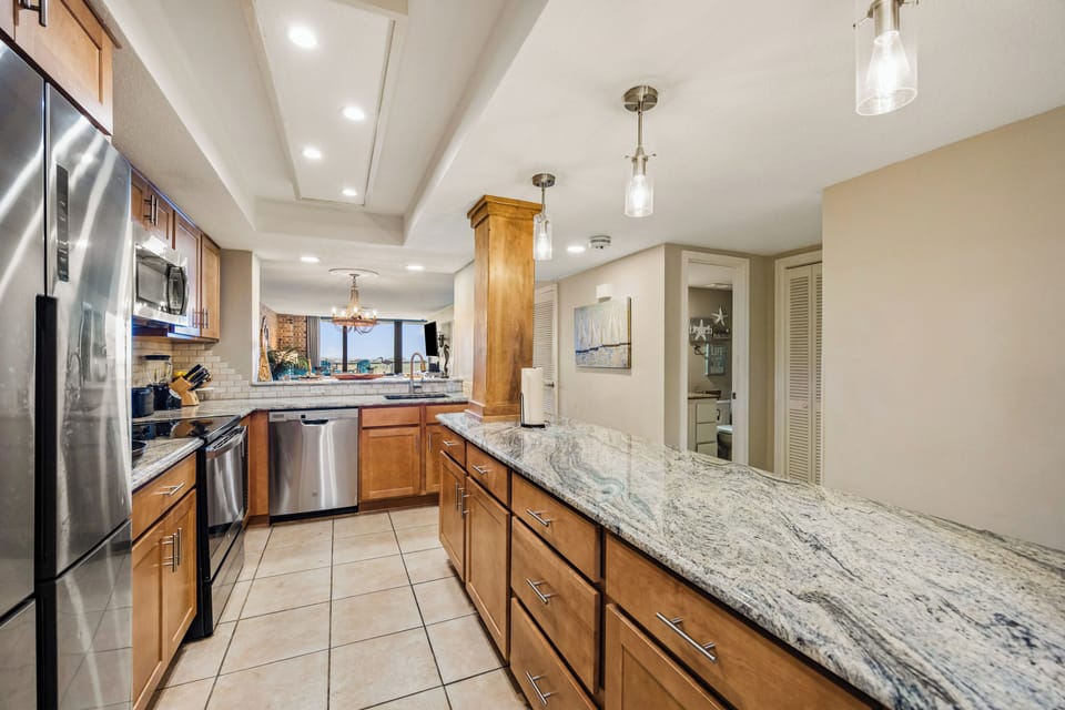 The spacious kitchen has plenty of storage and prep areas.