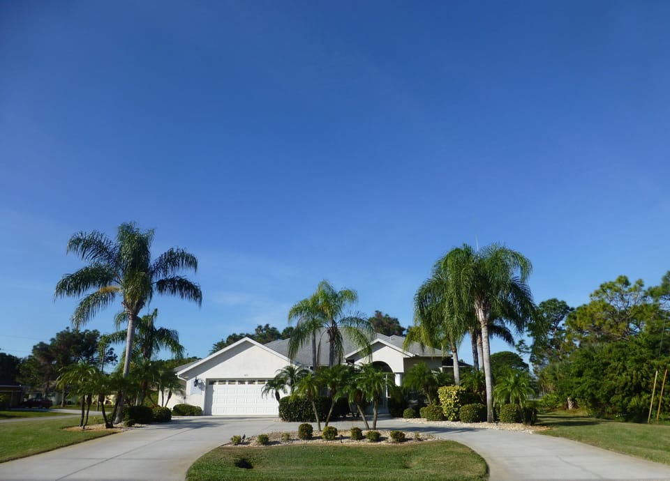 Front view of home on double corner lots in quiet residential area 

