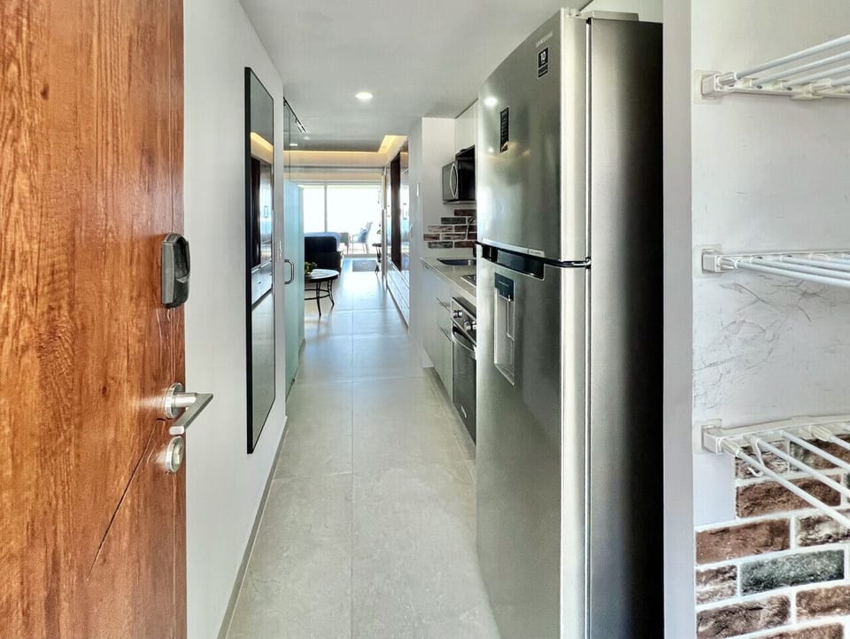 Entry view through kitchen to balcony
