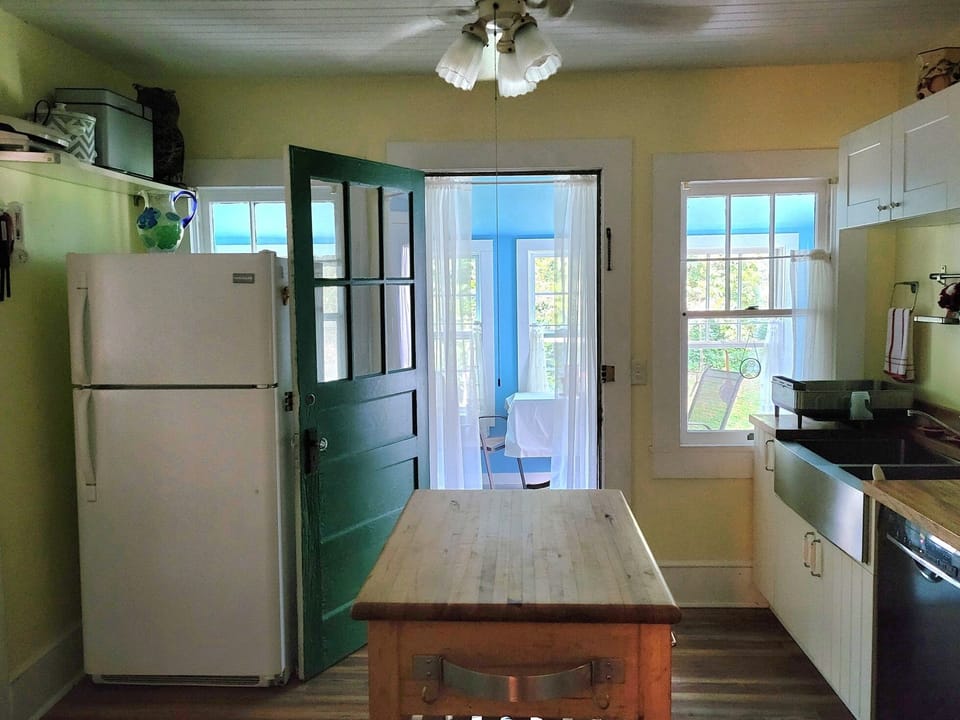 Kitchen, with entryway to the sunroom.