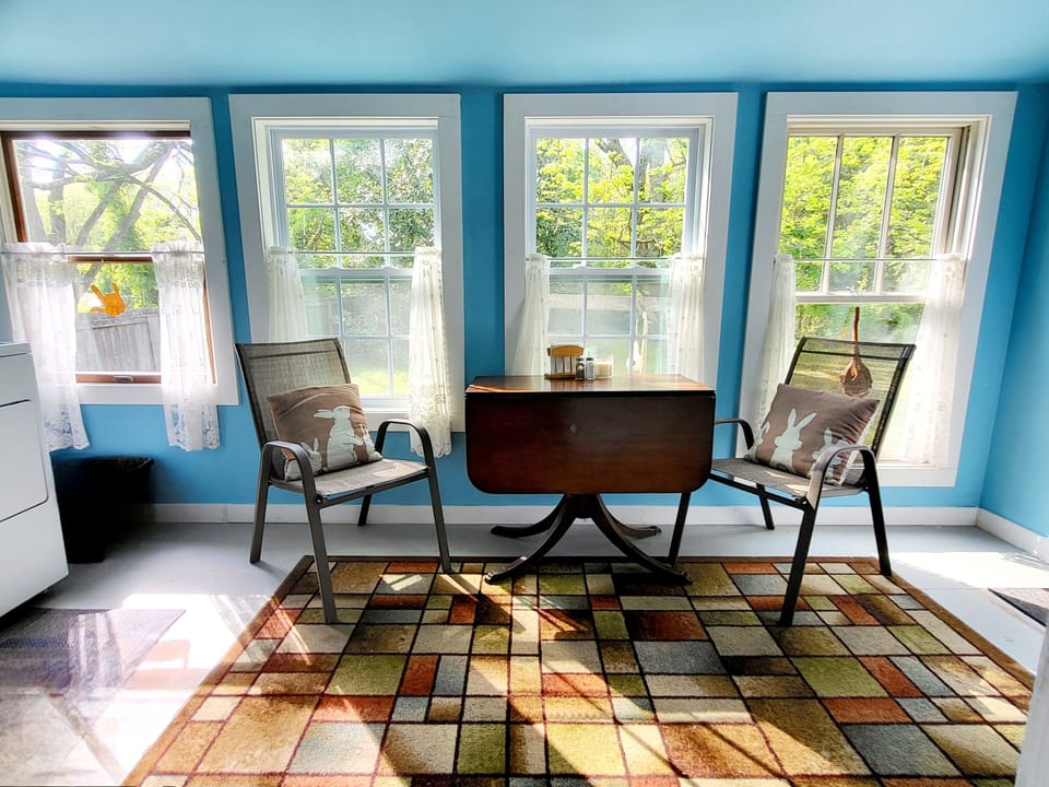 Backporch sunroom. Enjoy your coffee and a view of a big ol' sunny backyard.