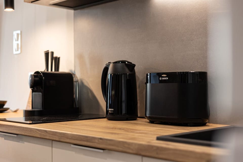 Functional kitchen with full equipment, perfect for preparing breakfast, apartment in the heart of Bydgoszcz near Mill Island.