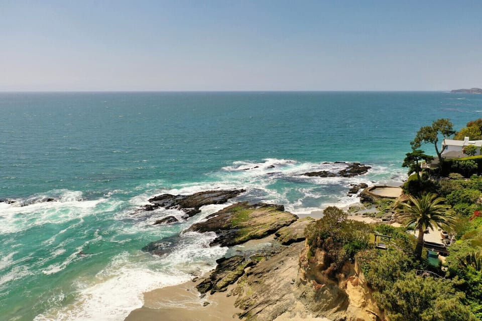 Spectacular coastal view with waves crashing on rocky shores.