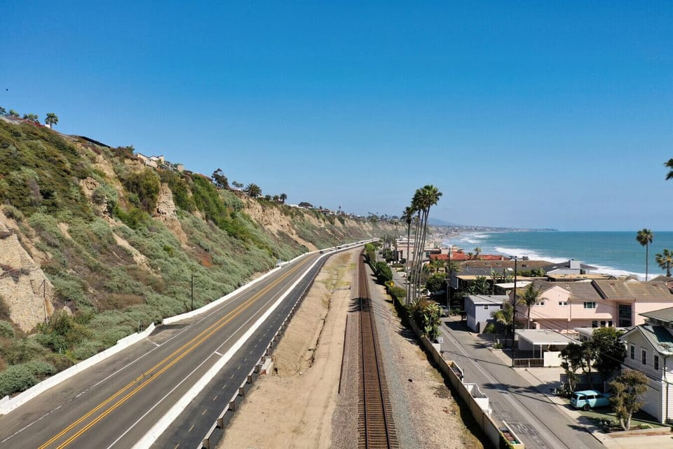 Scenic coastal drive with dramatic cliffs and ocean views.