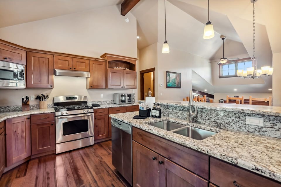 Kitchen: Main floor, drip coffee maker, Keurig, toaster, cooking utensils, tableware
