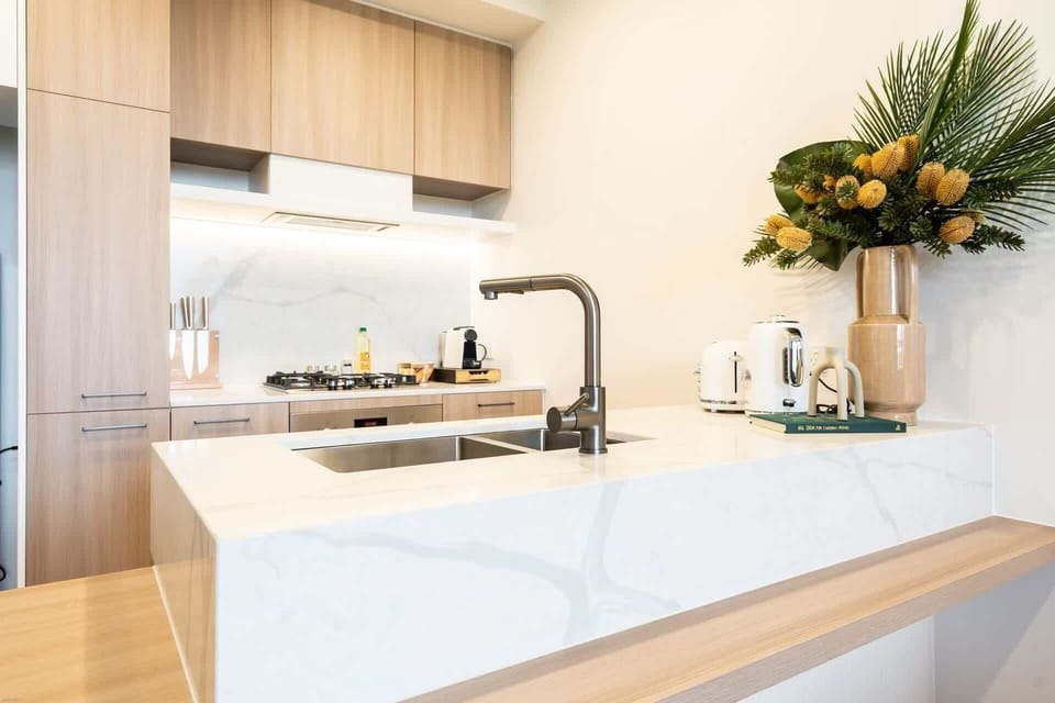 Fully equipped kitchen with capsule coffee machine, toaster, and kettle
