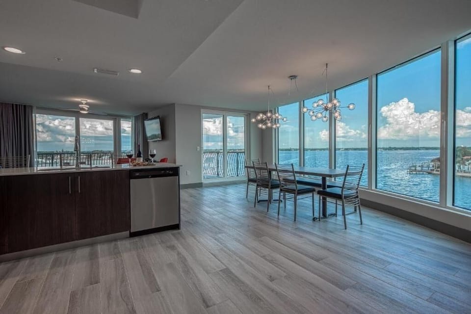Gather by panoramic windows for unforgettable waterfront lounging and dining.