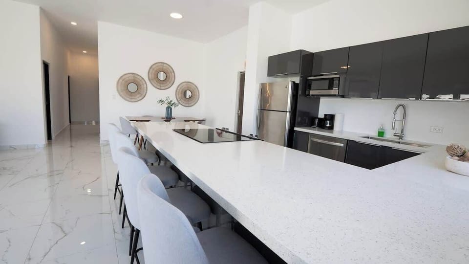 The oversized island keeps everyone connected while meals are prepared.