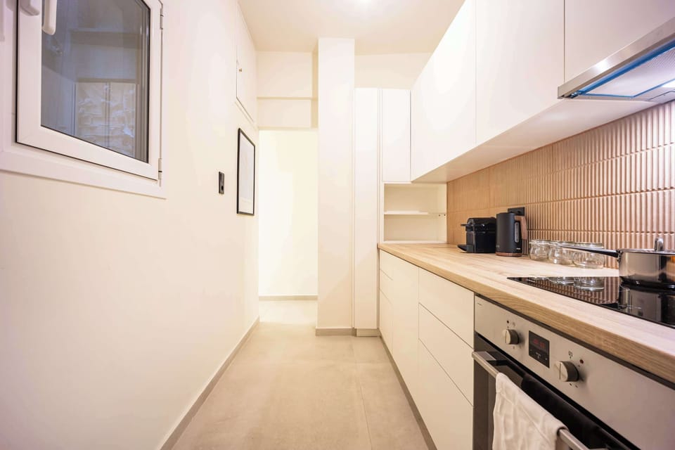 Long streamlined kitchen layout providing generous prep space for convenient home cooking.