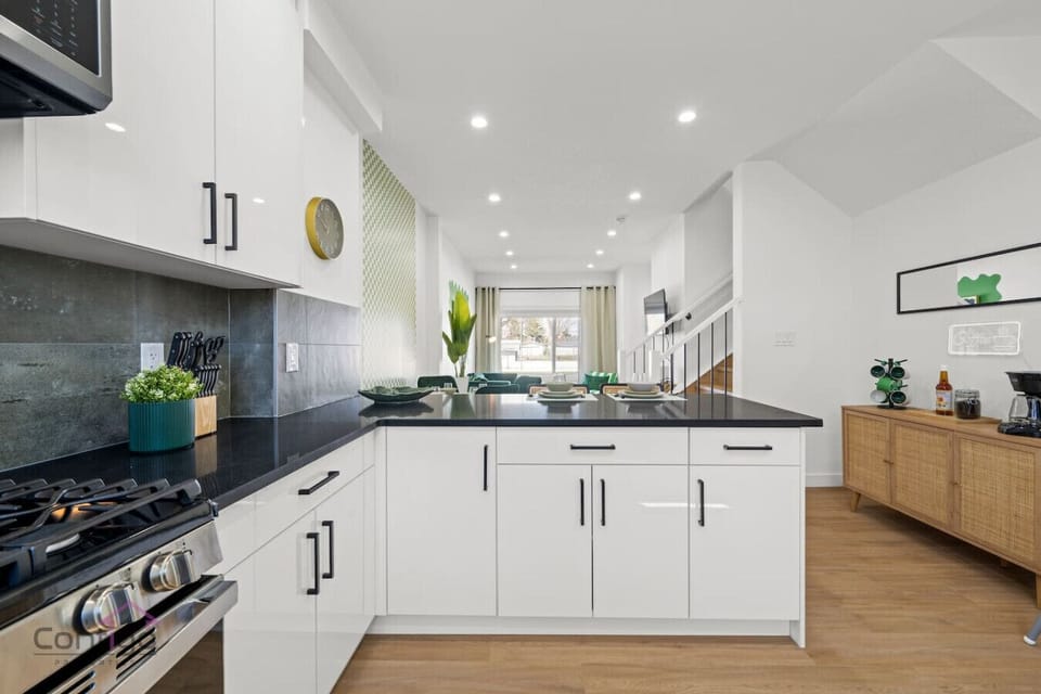 Unleash your inner chef! Our open kitchen features a modern stove and a set of knives ready for your culinary creations.