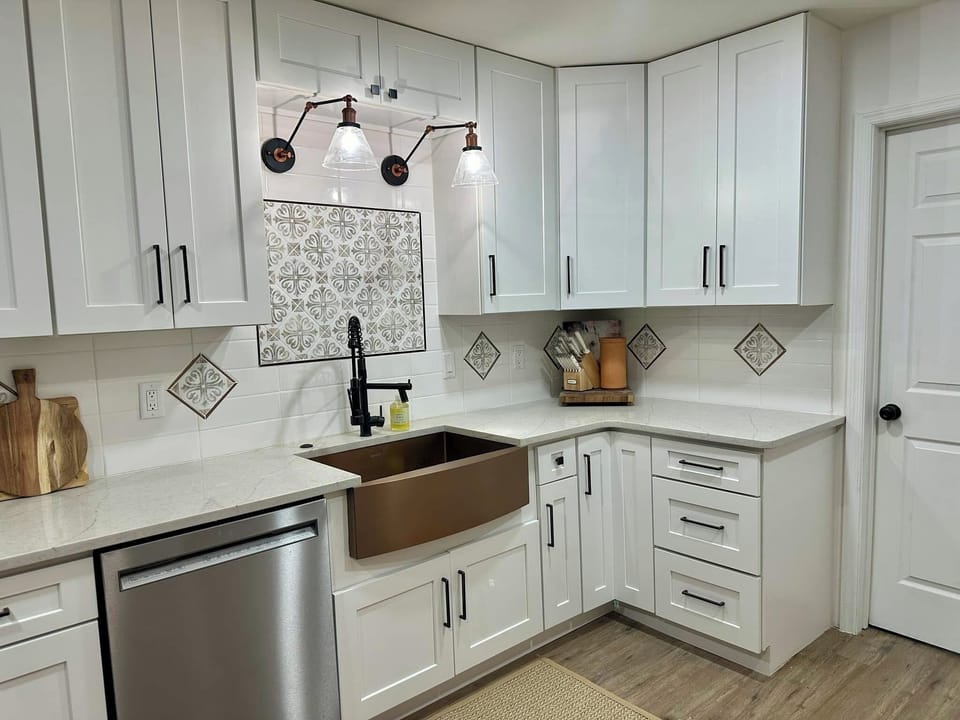 Beautiful modern kitchen features well stocked supplies and chef’s dream