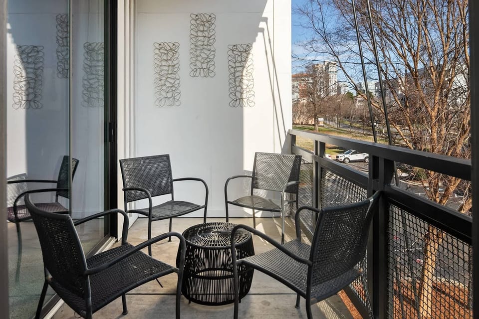 Private balcony overlooking the community, partial Uptown view