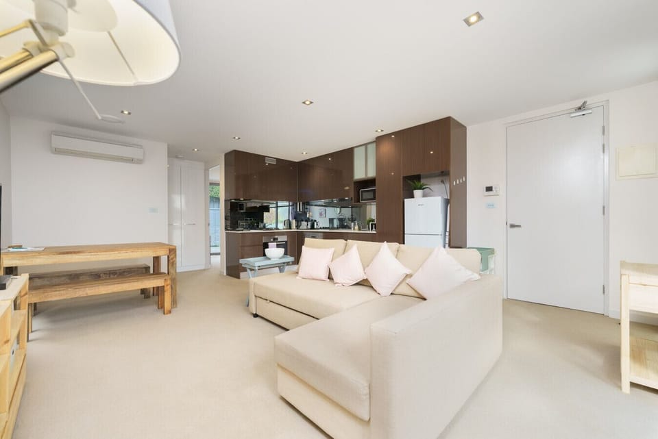 A bright, airy living space with ample seating, creating a welcoming environment for both relaxation and socialising.