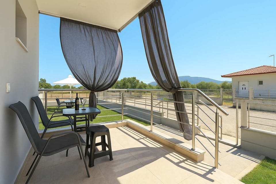 Enjoy a quiet sunrise with coffee on your  balcony, overlooking tranquil olive groves.