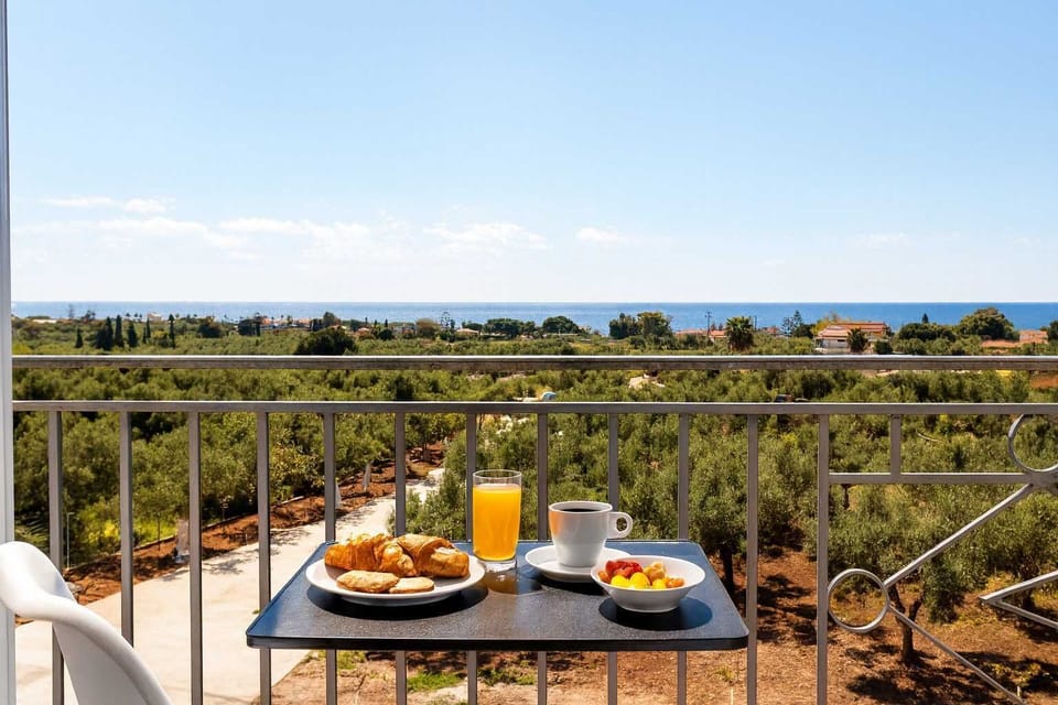 Private Balcony with Outdoor Dining and Scenic Views – A relaxing spot to enjoy breakfast or evening drinks with a view of the countryside.