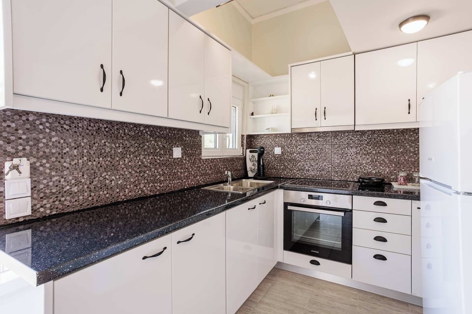 Amenities in the kitchen - Functional and well lit for convenient use.